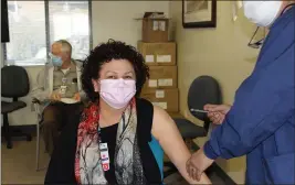  ?? COURTESY PHOTO ?? Dr. Paula Dhanda receives the first dose of the two dose Pfizer-biontech COVID-19 vaccines at Adventist Health in Clearlake on Dec. 21.