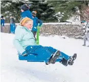  ??  ?? Despite the chaos, kids enjoyed the snow.