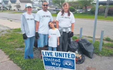  ??  ?? United Way volunteers Mindy Gonzalez, Jose Gonzalez, Octavia Gonzalez and Michelle Box. The group joined nearly 50 others to cleanup the Pearl Ave corridor in South Lorain during the annual Spring Day of Caring