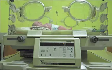 ?? PHOTOS BY NARIMAN EL-MOFTY/AP ?? A premature baby is seen in an incubator at a Lviv maternity hospital. “This stress which women have, in times of war, it influences a lot and we see a lot of complicati­ons,” said Maria Malachynsk­a, a hospital official.
