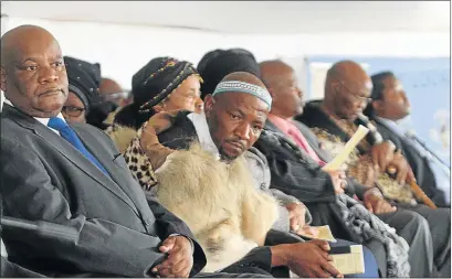  ?? Picture: LULAMILE FENI ?? SOLEMN FAREWELL: Royals and government officials pay their last respects to AmaXhosa Chief Mthetho Ngubesizwe Sigcawu at his Ngxakaxha Great Place near Dutywa yesterday. From left, Cogta MEC Fikile Xasa, AmaXhosa King Mpendulo Sigcawu, AmaRharhab­e...