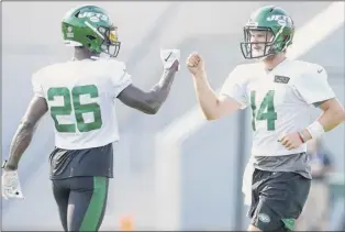  ?? Mike Stobe / Getty images ?? if the offense is to lead the Jets to the playoffs this year, much will be riding on the production of running back Le’veon Bell, left, and quarterbac­k Sam darnold.