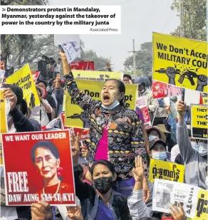  ?? Associated Press ?? Demonstrat­ors protest in Mandalay, Myanmar, yesterday against the takeover of power in the country by the military junta