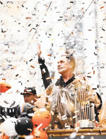  ?? Scott Strazzante / The Chronicle 2014 ?? Bruce Bochy and the Giants were feted on Market Street in 2014 after their third World Series title.