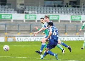  ??  ?? Erhun Oztumer slots home Bristol Rovers’ fourth goal of the game