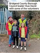  ?? ?? Bridgend County Borough Council leader Huw David with some of the volunteers