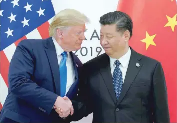  ?? — Reuters ?? US President Donald Trump meets with China’s President Xi Jinping at the start of their bilateral meeting at the G20 leaders summit in Osaka, Japan on June 29, 2019.