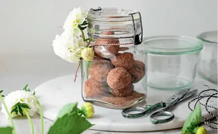  ?? NICOLA GALLOWAY ?? Two for the price of one ganache: chocolate and raspberry truffles, above, and hazelnut macaroons, left.