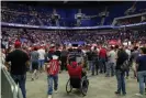  ?? Photograph: Evan Vucci/AP ?? Supporters listen to Trump speak.