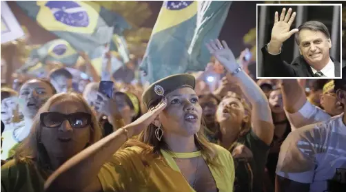  ?? LEO CORREA AP/ African News Agency ?? SUPPORTERS of Jair Bolsonaro (inset picture), Brazil’s president-elect, celebratin­g after the presidenti­al run-off vote outside his residence in Rio de Janeiro soon afterwards. |