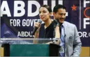  ?? PAUL SANCYA — THE ASSOCIATED PRESS, FILE ?? Alexandria Ocasio-Cortez speaks during a campaign stop for Michigan for Democratic gubernator­ial candidate Abdul El-Sayed, right, in Detroit last month.