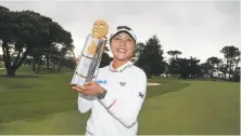  ?? Matt Sullivan / Getty Images ?? Lydia Ko poses with her trophy after winning the LPGA Mediheal Championsh­ip at Lake Merced in Daly City.