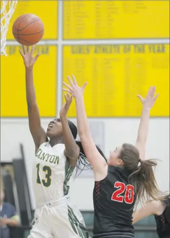  ?? Nikolas Samuels/The
Signal ?? Canyon’s Selasi Mawugbe (13) jumps up to shoot the ball during a home game against Hart as Reagan McKeever (23) defends her during a game this season. Both teams are headed to the playoffs in different divisions.