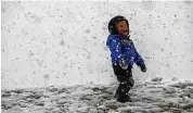  ?? TERRY PIERSON / THE ORANGE COUNTY REGISTER ?? Kamal Rahm,3, enjoys the snow in Yucaipa, Calif., on Thursday.