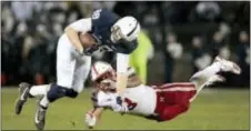  ?? CHRIS KNIGHT — THE ASSOCIATED PRESS ?? Penn State’s Mike Gesicki (88) gets upended by Nebraska’s Marcus Newby (3) after a catch during half in State College on Saturday. the first