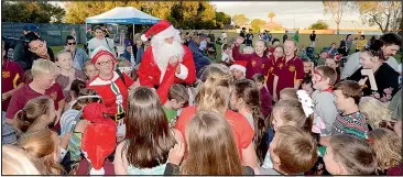 ??  ?? Santa was a popular guest at the ClubMulwal­a Carols on the Lawn.