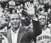  ?? FRANK GUNN THE CANADIAN PRESS ?? Former Toronto Raptors coach and current coach Detroit Pistons Dwane Casey waves to the crowd during a tribute before NBA action Toronto on Wednesday. Casey said it was strange being back.