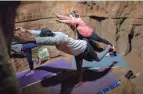  ??  ?? Xzavier Tate, left, and Allison Fitzgerald said they enjoyed doing yoga undergroun­d at Olentangy Indian Caverns, but next time they would bring another layer of clothing to help ward off the cooler temperatur­e.