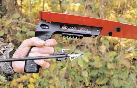  ?? Kansas City Star ?? The Game Vector system, which includes a radio transmitte­r attached to an arrow and a device to track location of the transmitte­r, is designed to help bow hunters find arrowed game such as deer and feral hogs that run into heavy cover before dying.