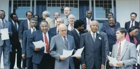  ?? NEWSPAPERS ARCHIVE AT UCT PICTURES: INDEPENDEN­T ?? Nelson Mandela with members of his first cabinet – including partner and rival, National Party leader FW de Klerk – outside Tuynhuys.