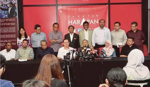  ?? FILE PIC ?? Prime Minister Tun Dr Mahathir Mohamad, flanked by Pakatan Harapan (PH) leaders, speaking at a press conference after chairing a PH meeting in Petaling Jaya. Dr Mahathir says a major accomplish­ment of the PH government is staying together after one year.