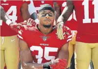  ?? MARCIO JOSE SANCHEZ/THE ASSOCIATED PRESS FILE PHOTO ?? Former San Francisco 49ers safety Eric Reid joined quarterbac­k Colin Kaepernick in silent protests during the national anthem.