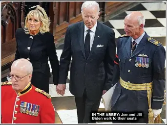  ?? ?? IN THE ABBEY: Joe and Jill Biden walk to their seats