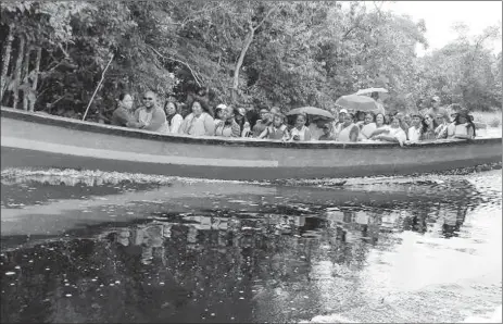  ??  ?? A boatload of visitors heading to Santa Aratack yesterday. (DPI photo)