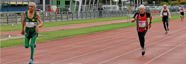  ??  ?? South African runner Lucas Nel, left, edges out Max Wood in the 80 and older men’s 200m at the New Zealand Masters’ Track and Field Championsh­ips in Invercargi­ll.