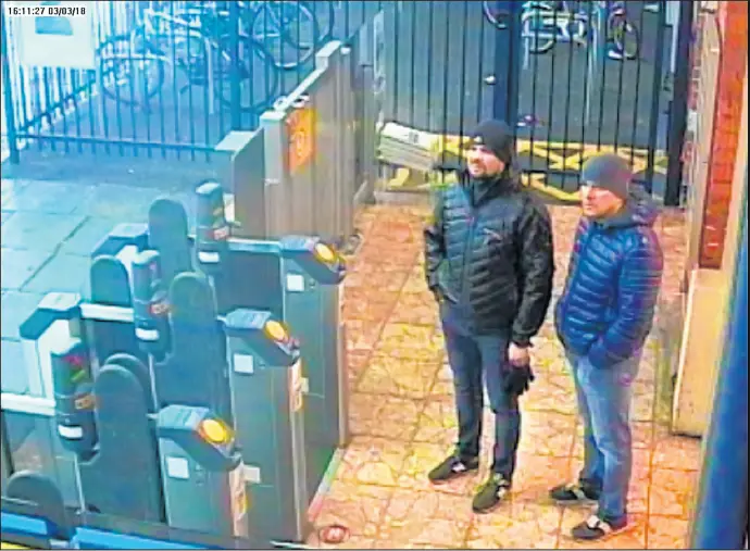  ?? METROPOLIT­AN POLICE OF GREATER LONDON ?? A surveillan­ce image shows Alexander Petrov and Ruslan Boshirov at a London train station on March 3. They have been named as suspects in the poisoning of former Russian spy Sergei Skripal and his daughter Yulia. Boshirov and Petrov allegedly flew to Britain two days before the poisoning and entered the country on Russian passports.