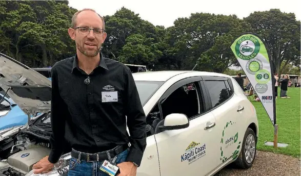  ??  ?? Kapiti Coast District Council environmen­tal adviser Jake Roos with council’s Nissan Leaf electric vehicle.
