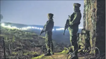  ?? GURINDER OSAN/HT FILE PHOTO ?? Indian soldiers at a forward post near the illuminate­d fence that marks the LoC in the Hamirpur area near Bhimber Gali, close to where one of Thursday’s strikes took place.