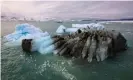  ?? Photograph: Hannibal Hanschke/Reuters ?? An iceberg off Greenland. Though soot from forest fires and algae are also responsibl­e for darkening ice, shipping emissions are a major cause.