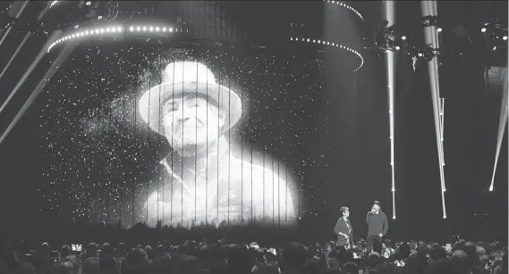  ??  ?? Pearl Wenjack, left, and Kevin Drew speak during a heart-warming tribute to Gord Downie at the Juno Awards in Vancouver on Sunday night.