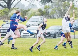  ??  ?? Right: Dalton Mooney kicks into the forward line for Bunyip.