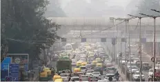  ?? AP ?? Vehicular traffic in New Delhi, India, as the city is enveloped under thick smog. The air quality index exceeded 400, about eight times the recommende­d maximum.