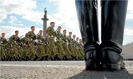  ?? AP ?? Russian troops march during a rehearsal yesterday for today’s Victory Day military parade in St Petersburg.