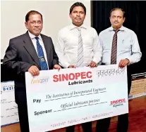  ??  ?? From left: INCO chairman - Eng. Lt. Col. Pani Kavikeshaw­a, Ushan Wijewarden­a (General Manager- Sinopec Lubricants) and Chandima Liyanarach­chi (National Sales Manager – Sinopec Lubricants)