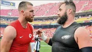  ?? Ed Zurga / Associated Press ?? Chiefs tight end Travis Kelce, left, and Eagles center Jason Kelce will become the first pair of siblings to play against each other in Super Bowl history.