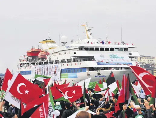  ?? ?? Pro-Palestinia­n activists wave Turkish and Palestinia­n flags during the welcoming ceremony for the cruise liner Mavi Marmara at the Sarayburnu port of Istanbul, Türkiye, Dec. 26, 2010.