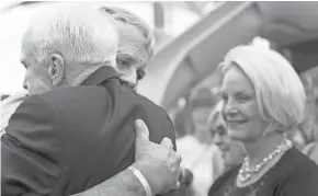  ?? CHERYL EVANS/THE REPUBLIC ?? Carl Mueller hugs Sen. John McCain during the grand opening of Kayla’s Hands Playground in Prescott on Aug. 27, 2016. Carl Mueller’s daughter, Kayla Mueller, was an aid worker who was abducted and killed while being held captive by ISIS.