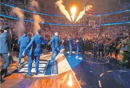  ?? STEPHEN M. DOWELL/ORLANDO SENTINEL ?? Magic players are introduced before Game 3 of the first-round series against the Raptors at the Amway Center on Friday.
