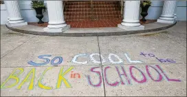  ?? EMILY JENKINS / AJC ?? “So cool to be back to school” chalk art is seen in front of an elementary school in August 2016. This year, parents are reminded that matching their children with the right teachers is an intricate process. Principals take hiring seriously, and they...