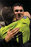  ??  ?? Drogheda United assistant boss Kevin Doherty - a former Shelbourne player and manager - celebrates with striker Chris Lyons after the final whistle.