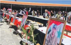  ??  ?? Funeral pictures of victims of the suicide bombings that hit Sweida province in July, when ISIS also abducted 30 people EPA