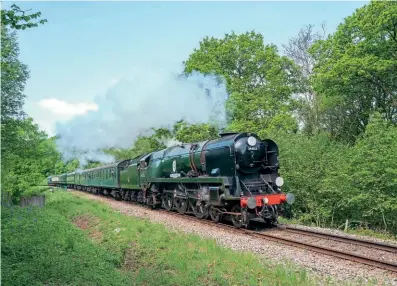  ?? NICK GILLIAM ?? Heading one of its last Spa Valley Railway service trains, Battle of Britain Pacific No. 34053 Sir Keith Park passes Coldbath bridge with the 11.30am from Eridge on May 14.