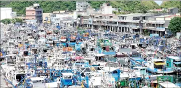  ??  ?? Fishing boats take shelter at Nanfangao fish harbour in Suao, Yilan county in east Taiwan. — AFP photo