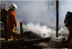  ??  ?? Photo shows what is left after fire destroyed a house and a motorcycle at Kampung Pueh.