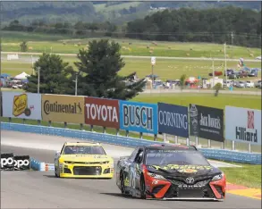  ?? Julie Jacobson / Associated Press ?? Martin Truex Jr. makes his way around the course at Watkins Glen Internatio­nal Speedway on Saturday during a practice session.