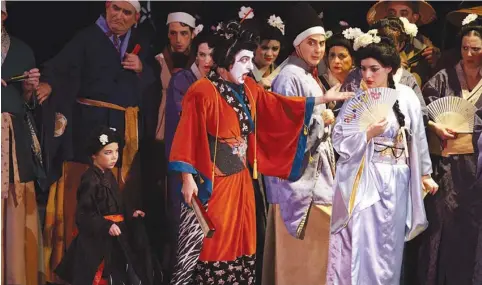  ?? (Brian Negin) ?? BIG IN Japan: Katisha (played by Sandy Cash) reprimands Yum-Yum (Aviella Trapido) in the first act finale of ‘The Mikado.’